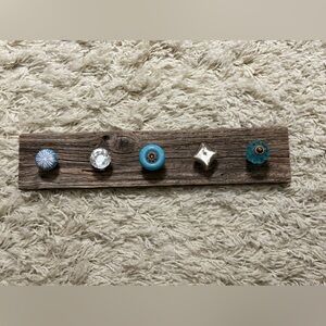 Handmade ocean-wood jewelry holder with decorative knobs